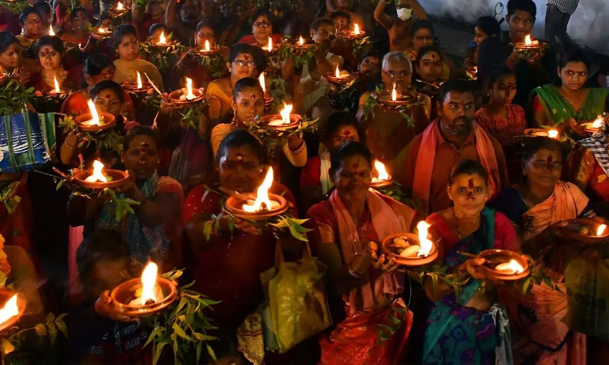 Bhavani devotees participate in ‘Kalasa Jyothi procession’ in Vijayawada on Tuesday  	 					(Photo Ch Venkata Mastan )