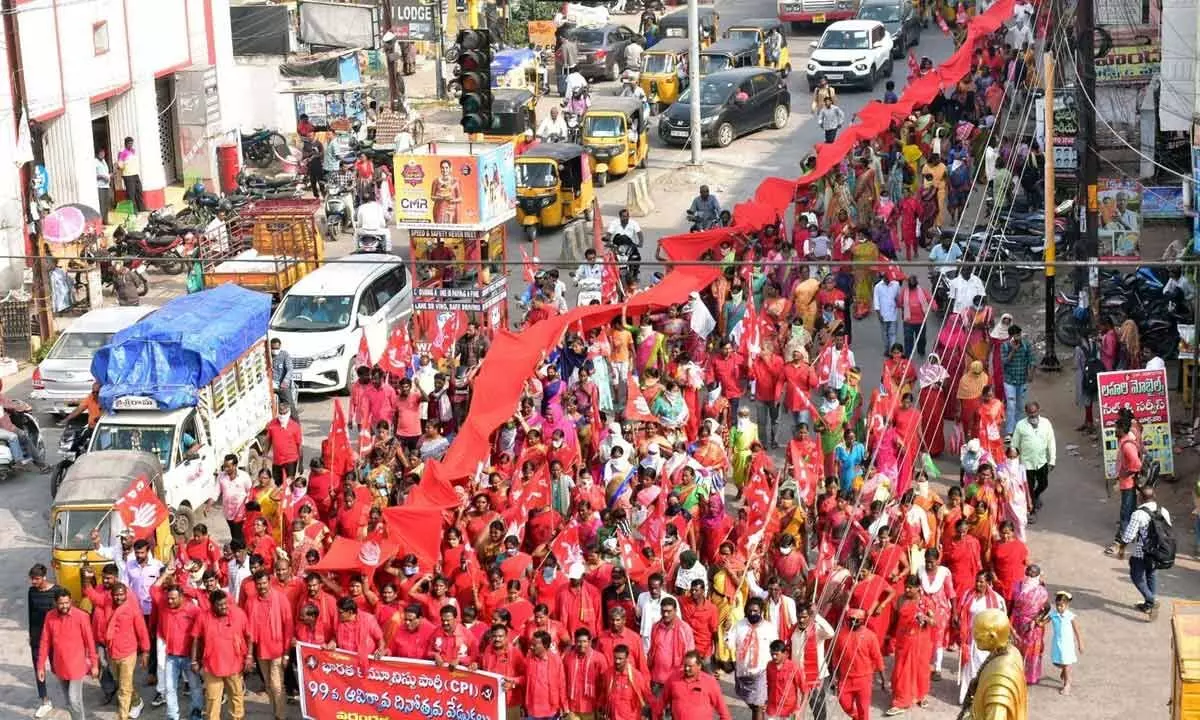 CPI cadres taking out a massive rally carrying a 99-meter-long red flag in Warangal on Tuesday