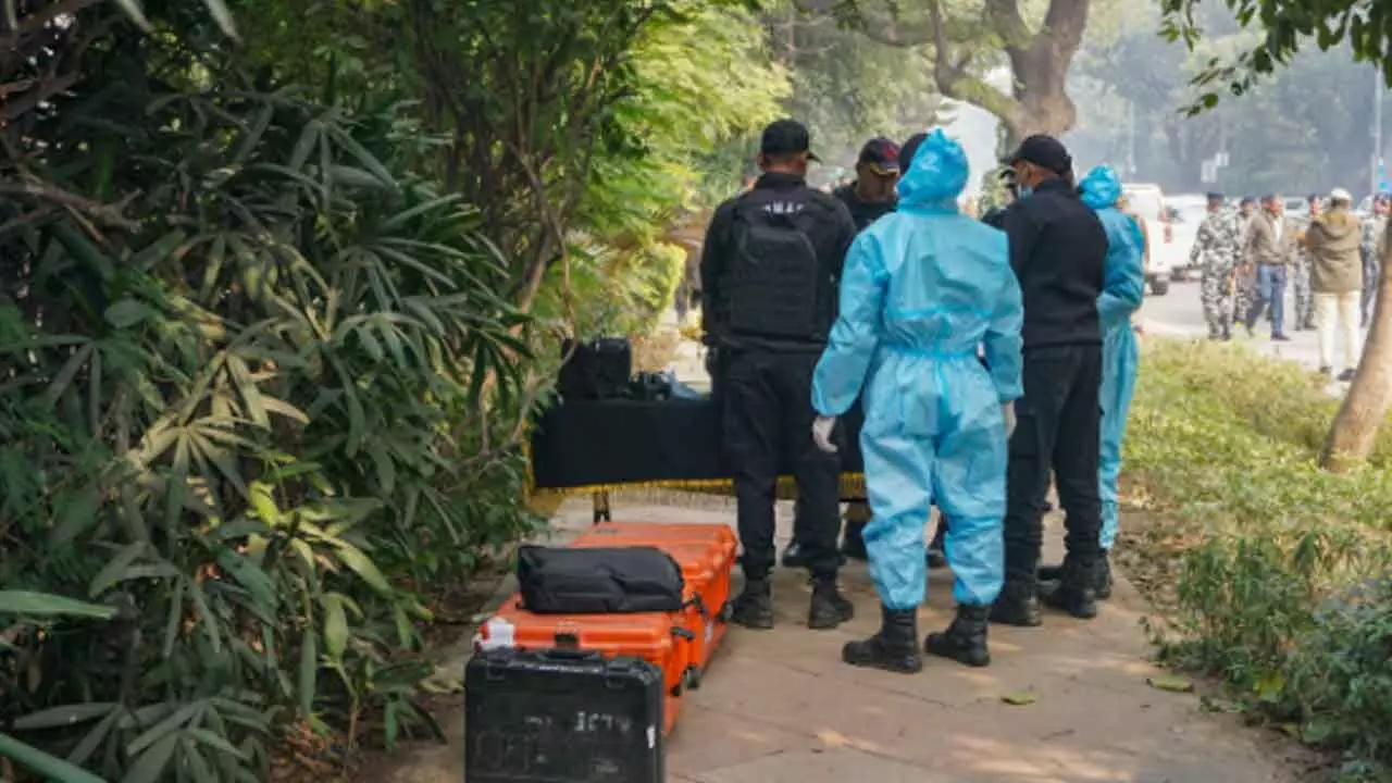 NSG Commandos with the forensic officials during an investigation near the Israeli embassy after a reported low intensity blast nearby, in New Delhi on Wednesday. The Delhi Police has intensified its probe into a low intensity blast that occurred near the Israel Embassy here and sources said two youths were caught on camera walking on the road close to the spot shortly before the explosion