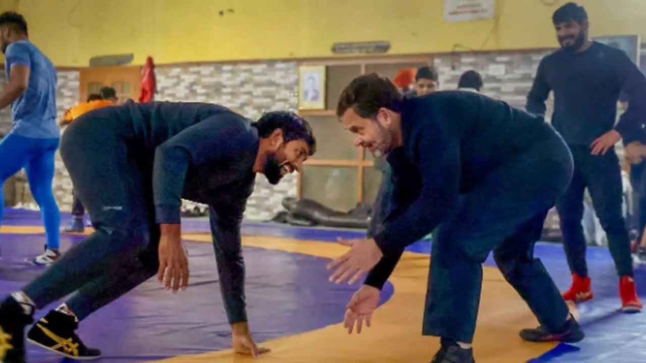 Congress leader Rahul Gandhi with wrestler Bajrang Punia and other wrestlers at Chhara village, in Jhajjar district on Wednesday