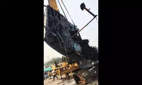 Visakhapatnam Port Authority recovering the sunken fishing boats at Fishing Harbour in Visakhapatnam on Thursday
