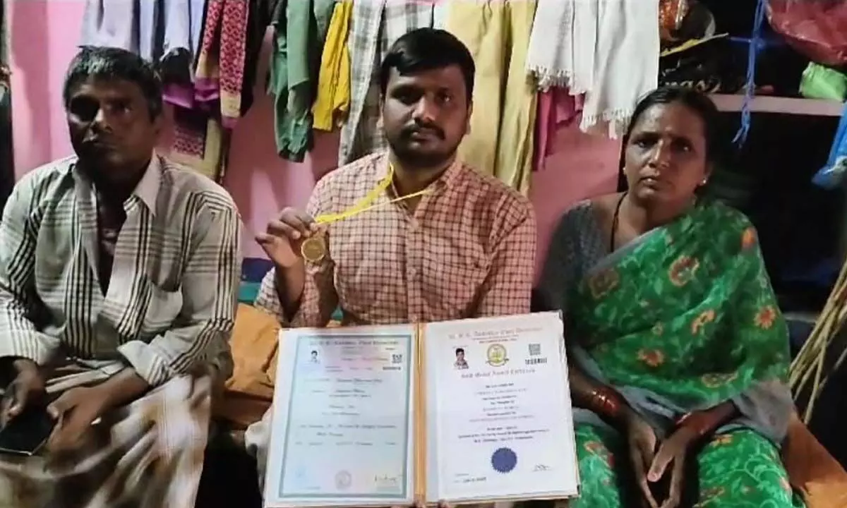 flanked by parents, Rafi showing the gold medal