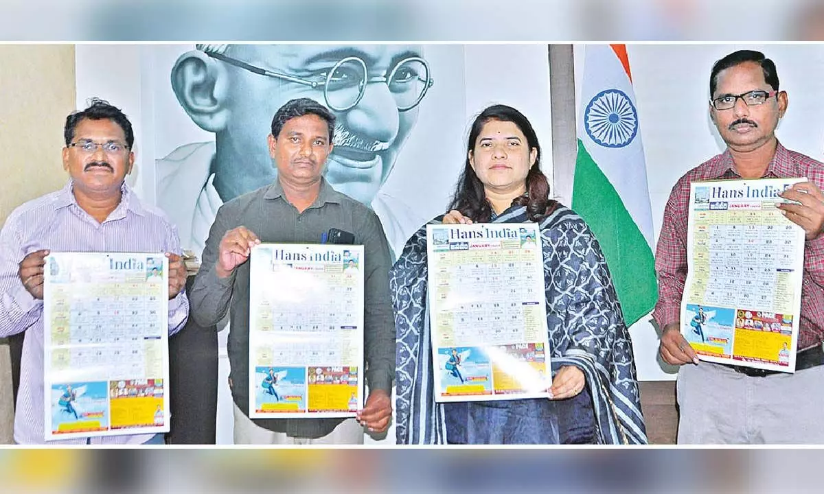 Joint Collector G Rajakumari releasing The Hans India New Year 2024 calendar at a programme held at her chamber in the Collectorate in Guntur city on Saturday