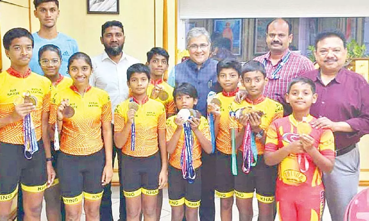 Divisional Railway Manager Narendra A Patil with the medal-winning  roller skating players in Vijayawada