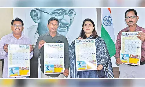 Joint Collector G Rajakumari releasing The Hans India New Year 2024 calendar at a programme held at her chamber in the Collectorate in Guntur city on Saturday