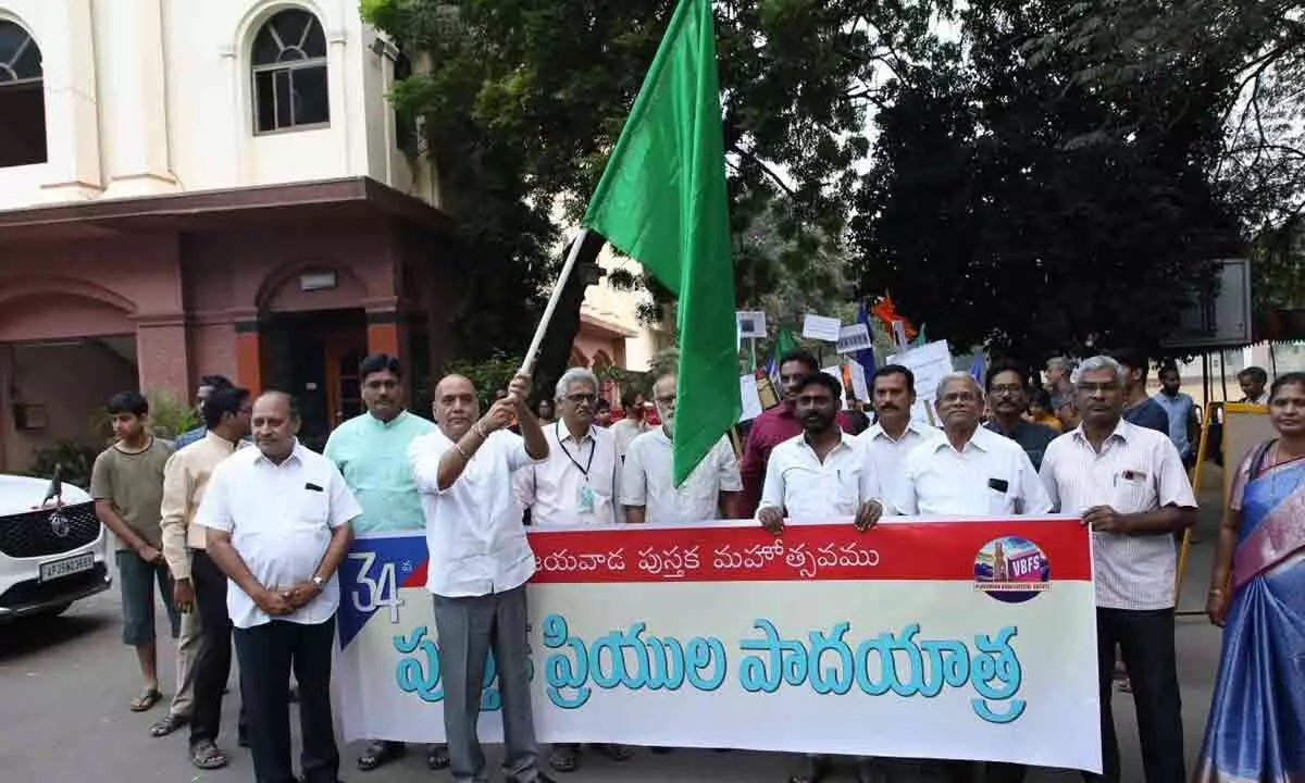 Special Chief Secretary R P Sisodia flagging off the Walk for Books in Vijayawada on Monday