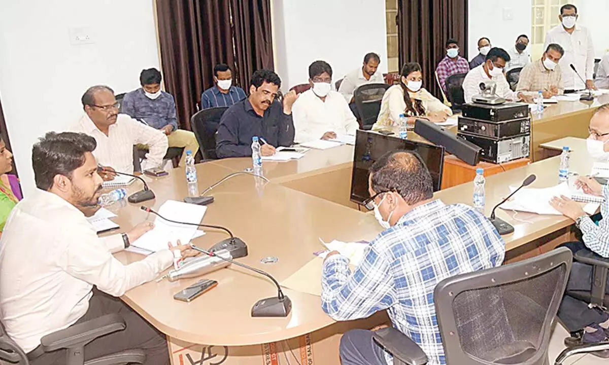 District collector Prasanna Venkatesh holding a review meeting with officials in Eluru on Tuesday
