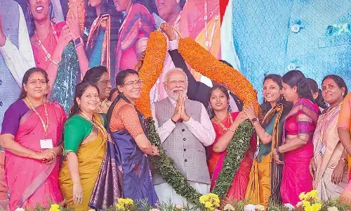 Prime Minister Narendra Modi being garlanded during a BJP-organised womens convention Sthree Shakthi Modikkoppam (Empowered Women with Modi), in Thrissur on Wednesday. Rajya Sabha MP PT Usha and actor Shobana Chandrakumar Pillai are also seen