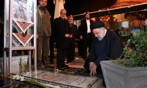 Iran arrests suspects over bomb blasts, mourners demand revenge - state TV