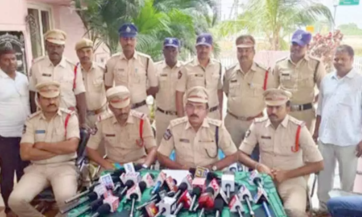 DSP V Srinivasa Reddy addressing a media conference at the rural police station in Dhone on Friday
