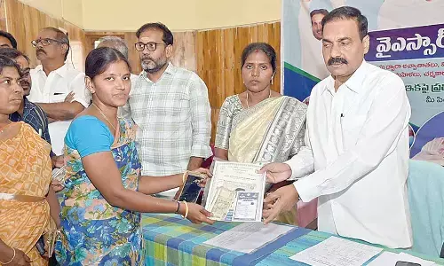 Agriculture Minister Kakani Govardhan Reddy distributing the newly-hiked pensions to the beneficiaries in Venkatachalam mandal in Sarvepalle constituency in Nellore district on Friday