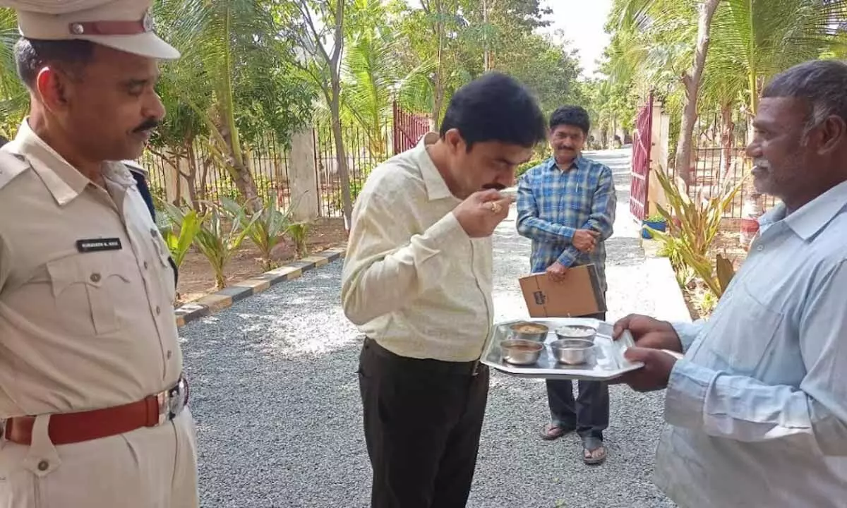 DLSA Secretary Ch Venkata Naga Srinivasa Rao tasting the food being served to the prisoners at district jail located in Panchalingala village on Saturday.