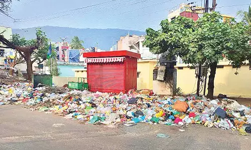 Bags of garbage strewn along the road near R&B junction in Visakhapatnam