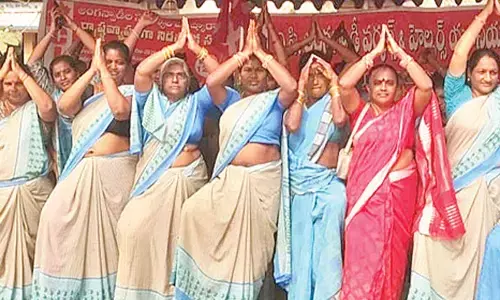 Anganwadi workers and helpers staging agitation in front of Collector office in Srikakulam