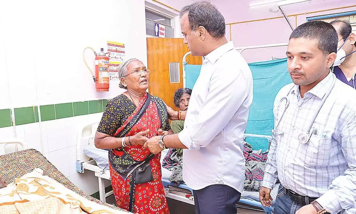 MLA Komatireddy Raj Gopal Reddy interacting with a patient about the facilities and treatment during his surprise visit to a government hospital in Choutuppal on Sunday