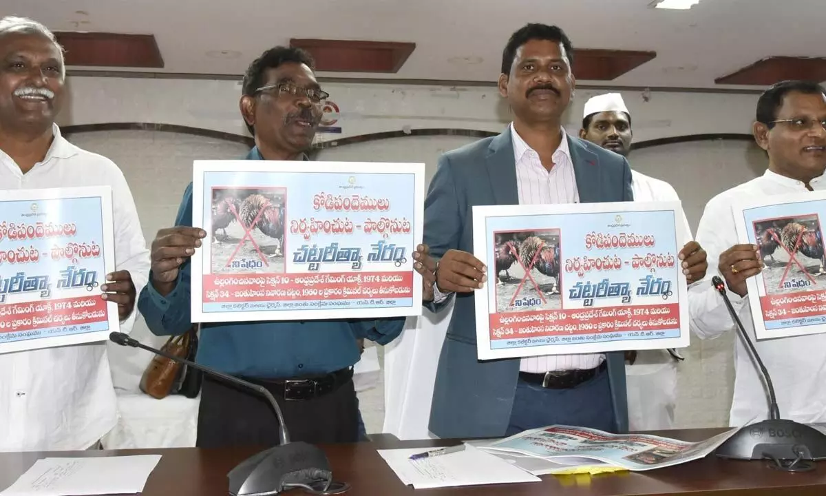 NTR District Collector S Dilli Rao and others releasing posters against cockfights in Vijayawada on Monday