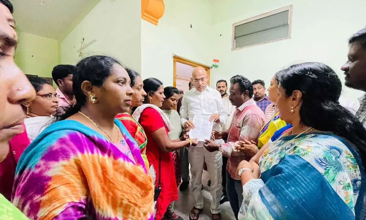 Minister Chelluboina Srinivasa Venugopala Krishna receiving petitions from Samagra Shiksha  Abhiyan contract and outsourced employees in Rajamahendravaram on Monday