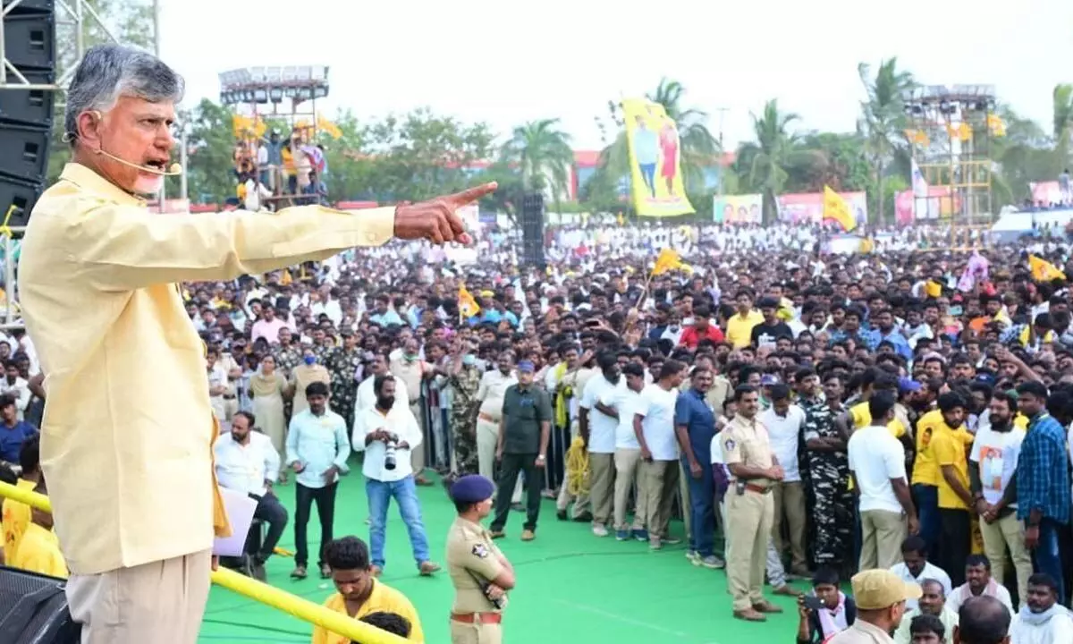 TDP chief N Chandrababu Naidu shows a mace to cheering party cadres at the Raa...Kadaliraa... public meeting at Allagadda in Kurnool district on Tuesday