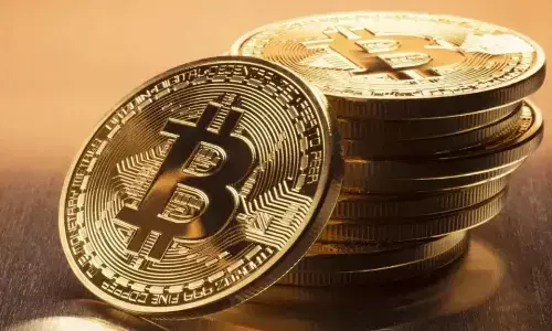 Bitcoin hits record high of $1,21,000