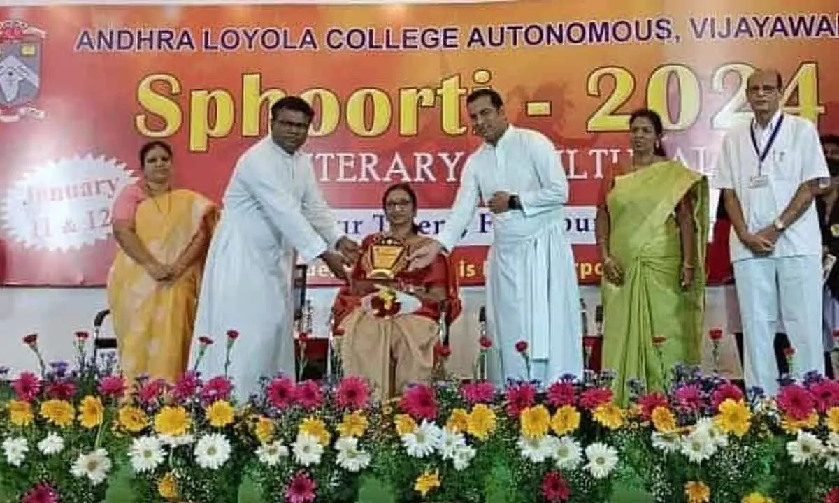 Secretary of AP Library Association Raavi Sarada being  felicitated by college management in Vijayawada on Thursday