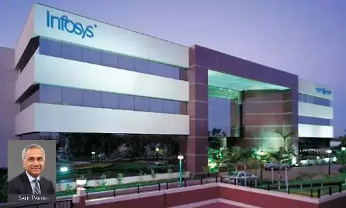 Infosys cuts annual sales forecast