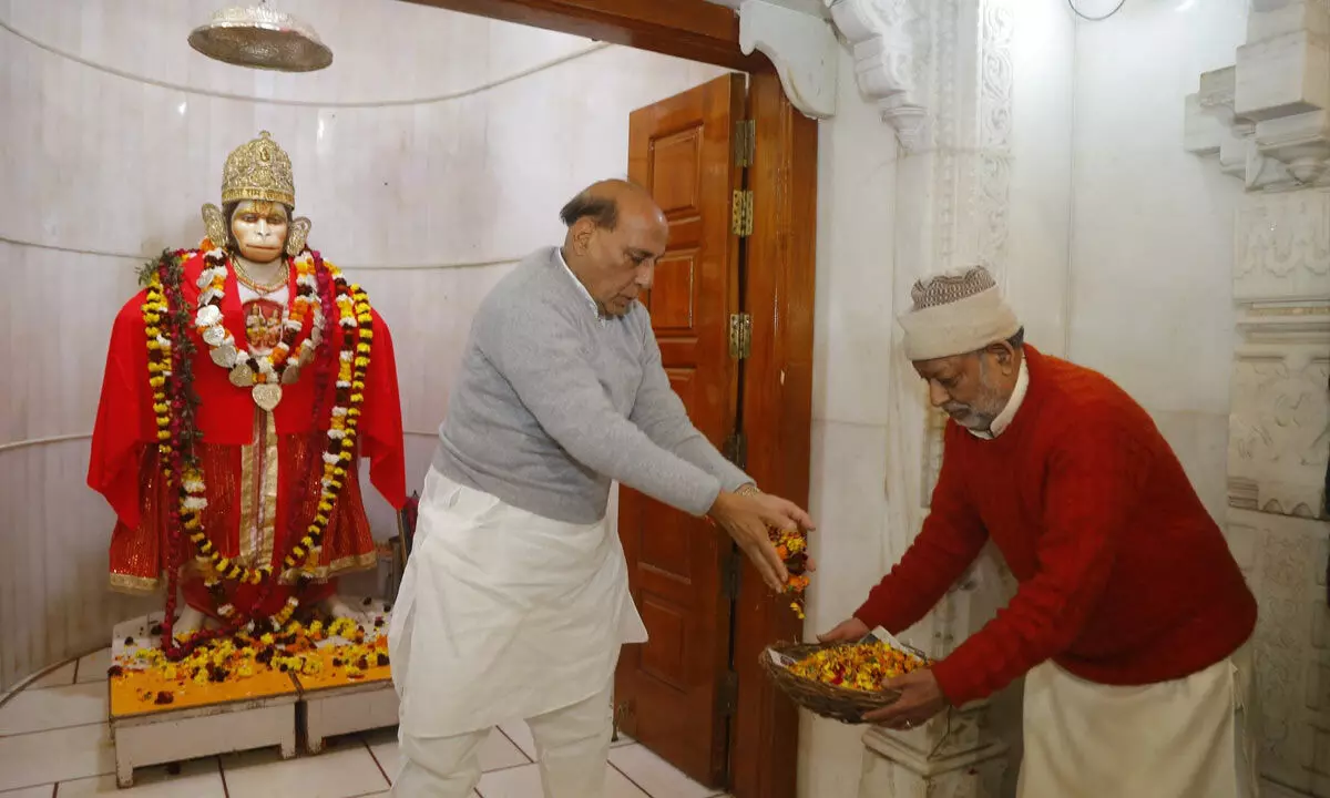 Lucknow: Defence Minister Rajnath Singh participates in cleanliness drive at temple