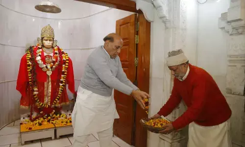 Lucknow: Defence Minister Rajnath Singh participates in cleanliness drive at temple