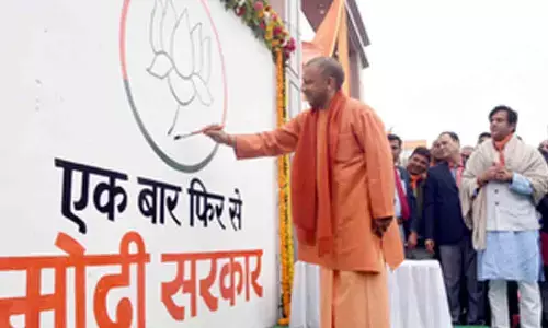 Yogi launches wall writing campaign with ‘Is baar BJP char sau paar’