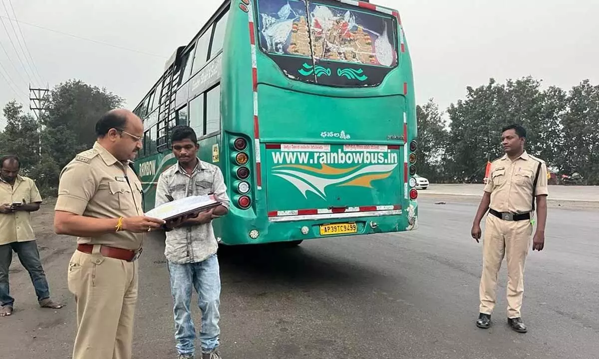 RTO officials inspecting buses  in Visakhapatnam on Tuesday