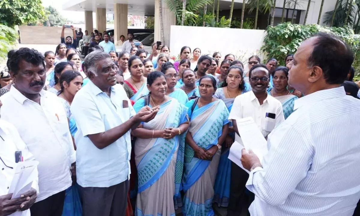 Anganwadi workers submitting a representation to Rajya Sabha member Vemireddy Prabhakara Reddy at his residence in Nellore on Tuesday