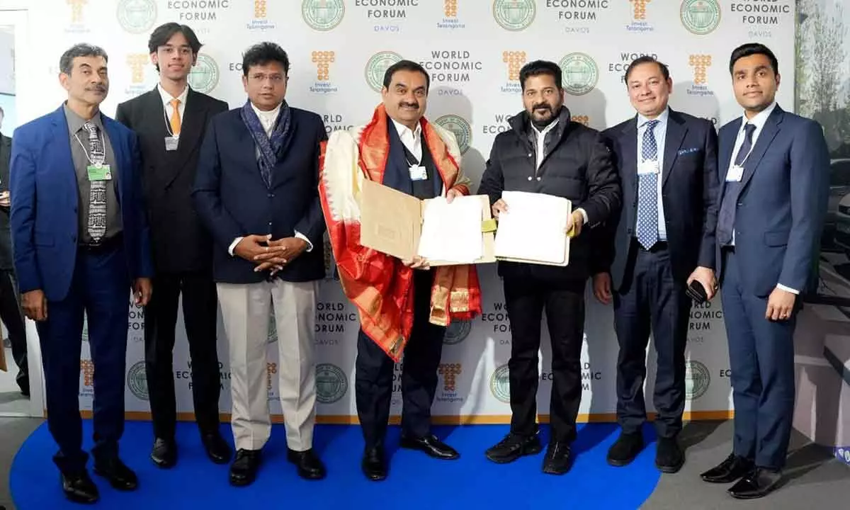 Chief Minister A Revanth Reddy and Minister of Industries Sridhar Babu with Adani Group  Chairman Gautam Adani on the sidelines of 54th annual meeting of the World Economic Forum,  in Davos, Switzerland