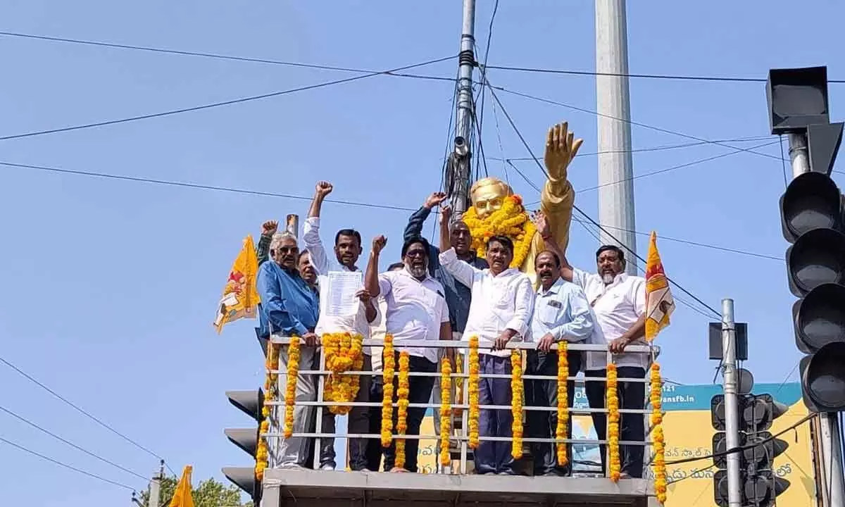 East Godavari District BC Welfare Association president S Rama Rao and others paying floral tributes to NTR’s statue in Rajamahendravaram on Thursday