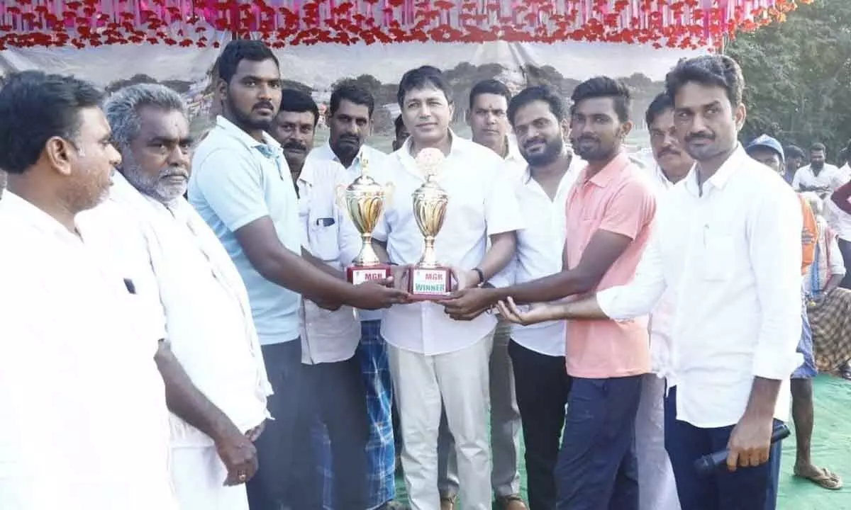 MLA Mekapati Vikram Reddy presenting prize to the winners of cricket tournament, in Brahmanapalli village on Thursday