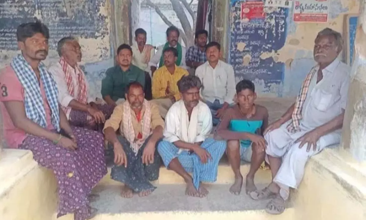 Villagers staging a protest in front of Tahsildar office in Agraharam village on Friday