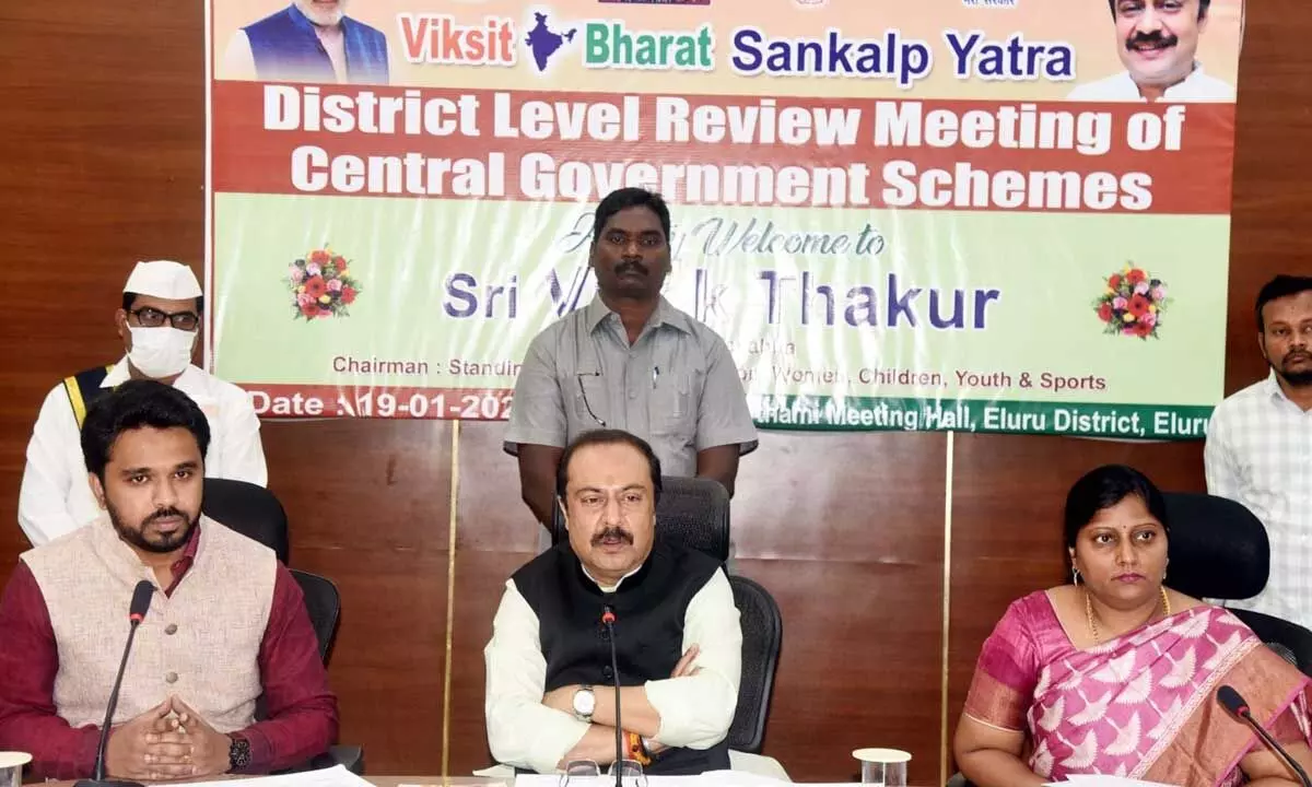 MP Vivek Thakur along with collector Prasanna Venkatesh and joint collector Lavanyaveni reviewing Viksit Bharat programme with officials in Eluru on Friday