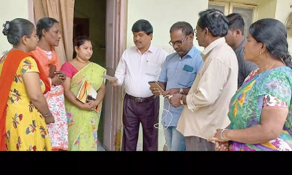 OMC Commissioner M Venkateswara Rao collecting information for caste census in Santha Pet of Ongole on Friday