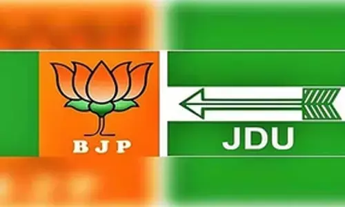 With rumours of political realignment rife in Bihar, BJP, JD(U) scale down attacks