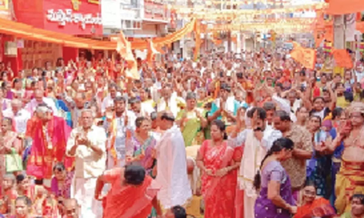Devotees celebrating consecration of Ram Lalla at Srirama temple on Gandhi Road in Ongole on Monday