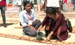 School students making arrangements for Deepotsavam in the evening on the banks of Sarayu School students making arrangements for Deepotsavam in the evening on the banks of Sarayu