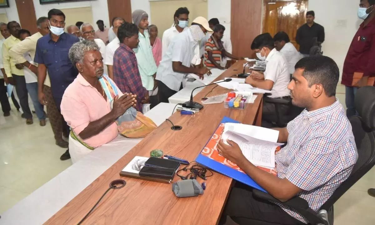 District Collector M Harinarayanan receiving petitions at Spandana and Jagananna Ku Chebudam programmes at the Collectorate in Nellore on Monday