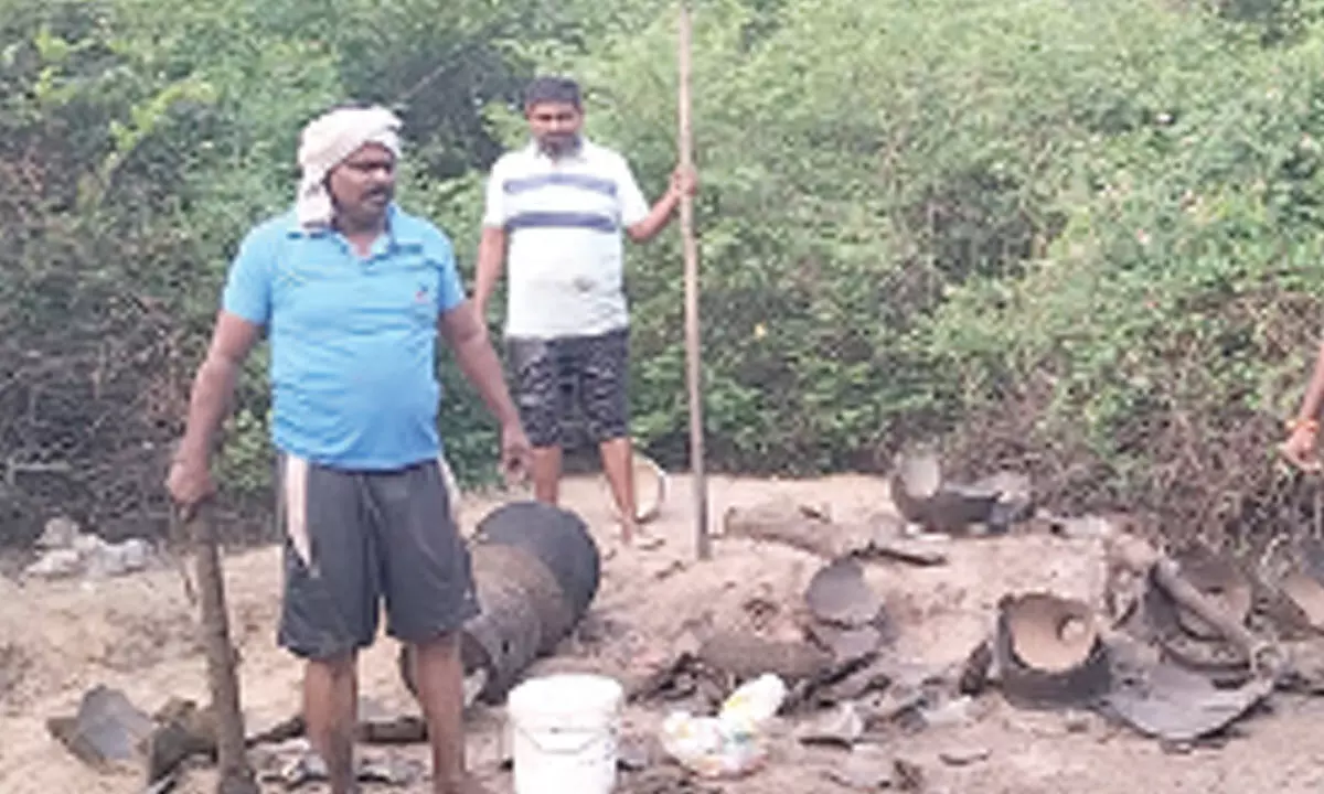 Bapatla district police destroying live kilns brewing arrack as part of cordon and search at Adavula Deevi PS on Tuesday