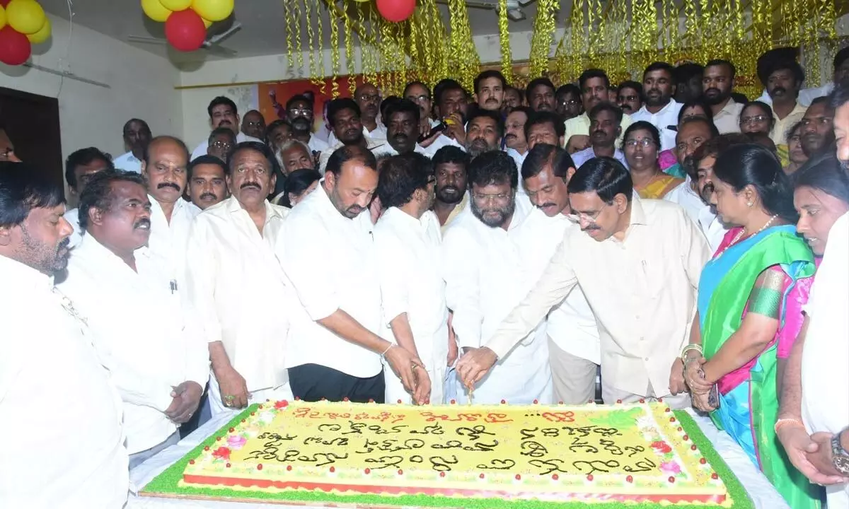 Former minister Ponguru Narayana cutting a cake on the occassion of TDP national general secretary Nara Lokesh birthday at party district office Nellore on Tuesday