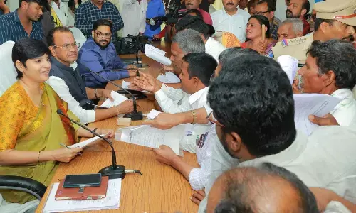 Minister Komatireddy Venkat Reddy along with collector Hari Chandana Dasari and JC Hemanth Keshav Patil during the Prajavani event in Nalgonda on Monday