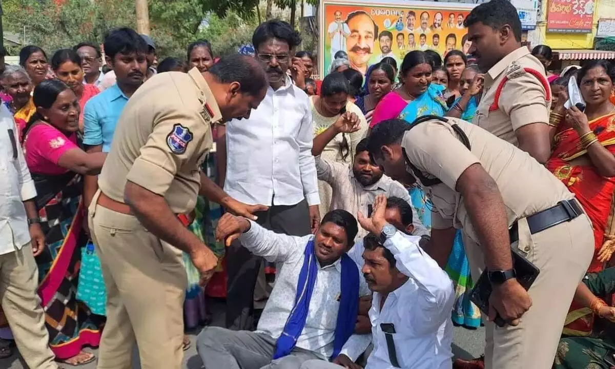 Protestors expressing their ire as police attempt to arrest them during a dharna in Suryapet on Tuesday