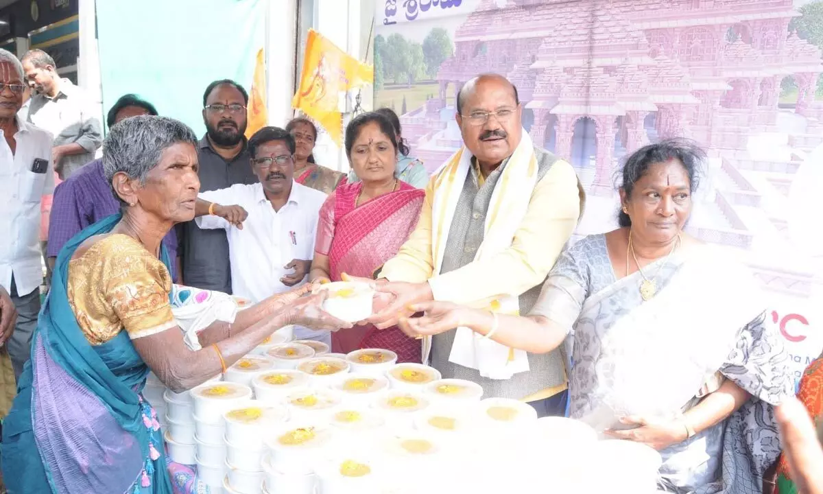 Dr P C Rayulu distributes Srirama Akshintalu, food packets