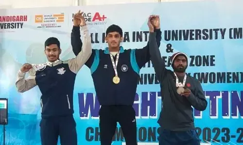 Abdullah (right) showing bronze medal that he won at All India Inter University Weightlifting Championship competitions held in Mohali in Punjab