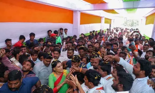 Party activists and leaders welcome PCC president Y S Sharmila as he arrives to address party activists meeting in Kadapa on Monday