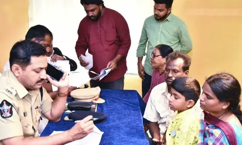 SP Madhav Reddy listening to a petitioner during grievance programme at Puttaparthi SP office on Monday