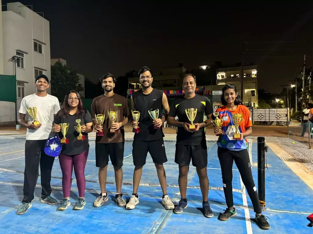 Ravula Sridhar Reddy presents prizes to winners. Pickle ball tournament winners