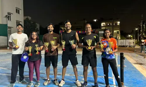 Ravula Sridhar Reddy presents prizes to winners. Pickle ball tournament winners